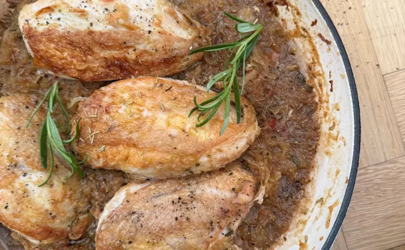 A rustic dish of chicken breasts slow cooked in lager, served with fresh herbs | Herb Fed Poultry