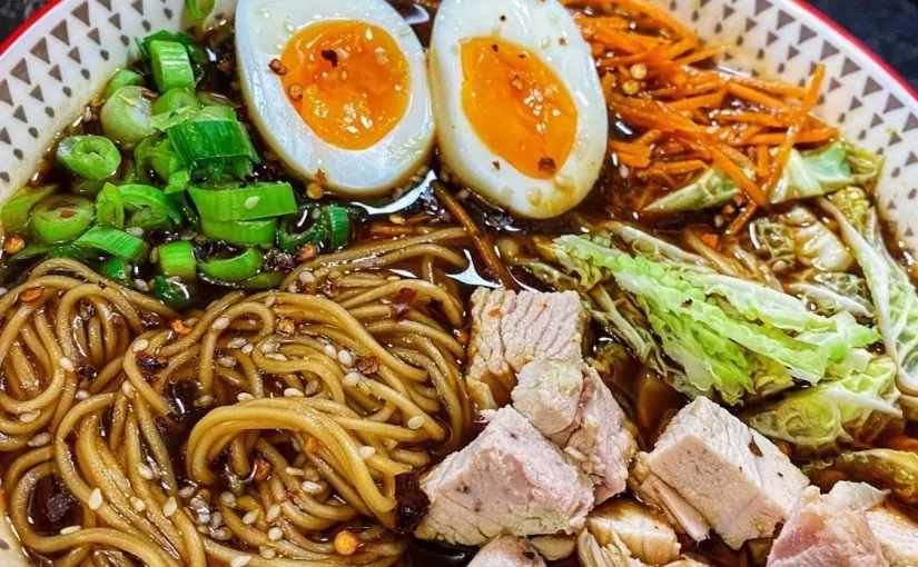 A plate of Turkey Ramen - A delicious dish of Herb Fed Turkey, noodles, eggs, cabbage in a Ramen sauce | Herb Fed Poultry