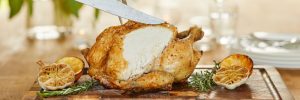 roast chicken on a plate. Which is best? Organic chicken v Regular Chicken