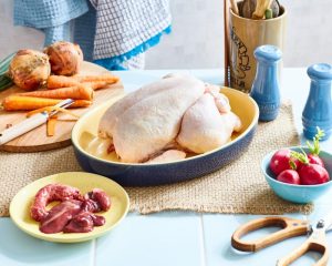 giblets and a chicken, ready to go into the oven
